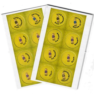 May include: Two sheets of game tokens with yellow backgrounds and circular designs. Each token features a scroll illustration and text such as "Ice Storm," "Water of Healing," and "Psychic Recovery." The tokens are in a white box.