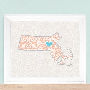 May include: A peach-colored map of Massachusetts with a light blue heart in the center. The map is on a white background with a light gray damask pattern.