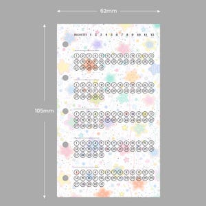 May include: A planner insert with a pastel star pattern and a monthly calendar layout. The page is 62mm wide and 105mm tall, with circles for each day of the month. The top of the page reads "MONTH 1 2 3 4 5 6 7 8 9 10 11 12".