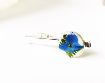 Pressed flower tie clip , blue hydrangea with ferns on white epixy clay, filled with resin