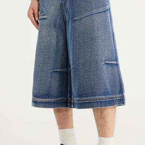 Denim Pleated Jorts | Pleated Wide Leg Cropped Jeans | Casual Wear | Street Style Trend

Medium blue denim jorts with pleated front detail and wide-leg knee-length fit, featuring a structured cropped streetwear style.