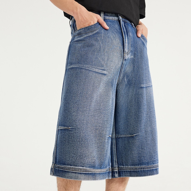 Denim Pleated Jorts | Pleated Wide Leg Cropped Jeans | Casual Wear | Street Style Trend

Medium blue denim jorts with pleated front detail and wide-leg knee-length fit, featuring a structured cropped streetwear style.