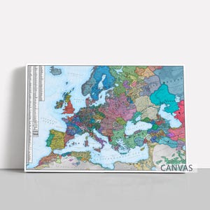 Puede incluir: Impresión en lienzo enmarcada de un mapa histórico de Europa, mostrando varios países en diferentes colores. El mapa incluye el texto "CANVAS" en la esquina inferior derecha y una escala detallada a la izquierda. El fondo es blanco.