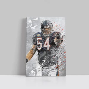 May include: A canvas print of an American football player in a black uniform with the number 54. The artwork has a watercolor effect with gray, black, and orange accents. The player is pointing forward, with a determined expression.