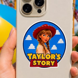 May include: A cream-colored smartphone case featuring a circular sticker with a cartoon character wearing a red cowgirl hat and braids, set against a blue sky with white clouds and the yellow and red text "TAYLOR'S STORY" at the bottom.