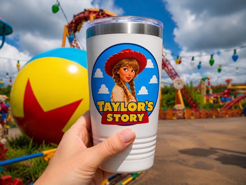 May include: A white stainless steel tumbler with a clear lid featuring a circular graphic of a person with braided hair wearing a red cowboy hat. The text "TAYLOR'S STORY" is printed in yellow with a red outline inside the blue circular design.