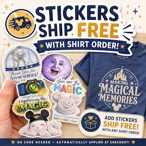 May include: A dark blue t-shirt with a white graphic of a castle and the text MAKING MAGICAL MEMORIES, accompanied by several stickers featuring a mouse chef, a moon, a camera, cinnamon rolls, and a rabbit, with text about free shipping.