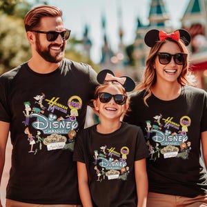 May include: Three people wearing black t-shirts with a colourful Disney Channel graphic featuring characters from "Hannah Montana" and "The Suite Life." The shirts have the Disney Channel logo and text. The people are smiling and wearing sunglasses.