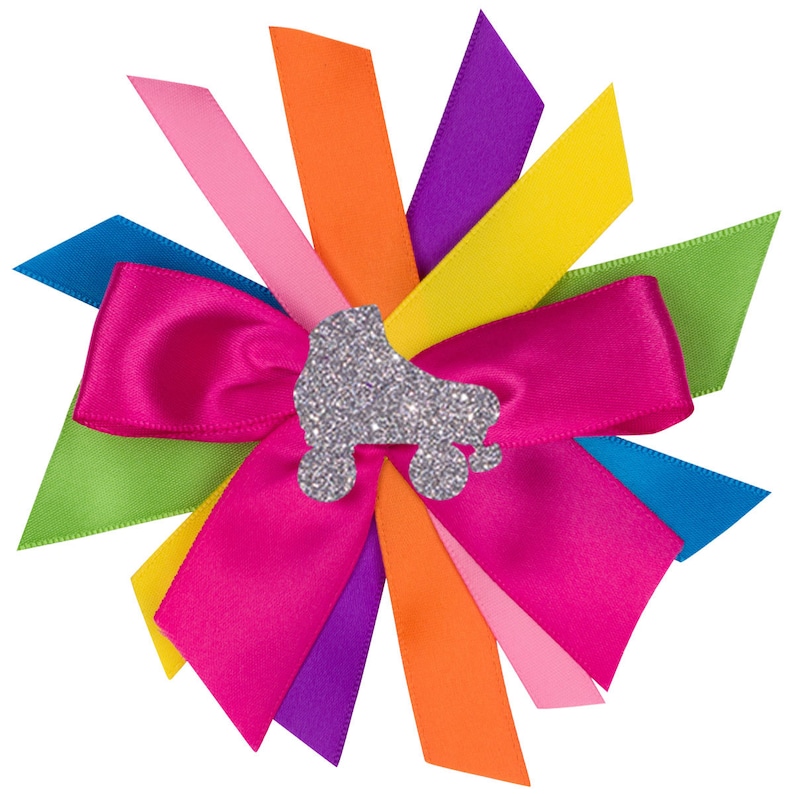 May include: A pink satin bow with a silver glitter roller skate design in the center. The bow is surrounded by eight ribbon tails in a rainbow of colors: pink, orange, yellow, green, blue, purple, and orange.