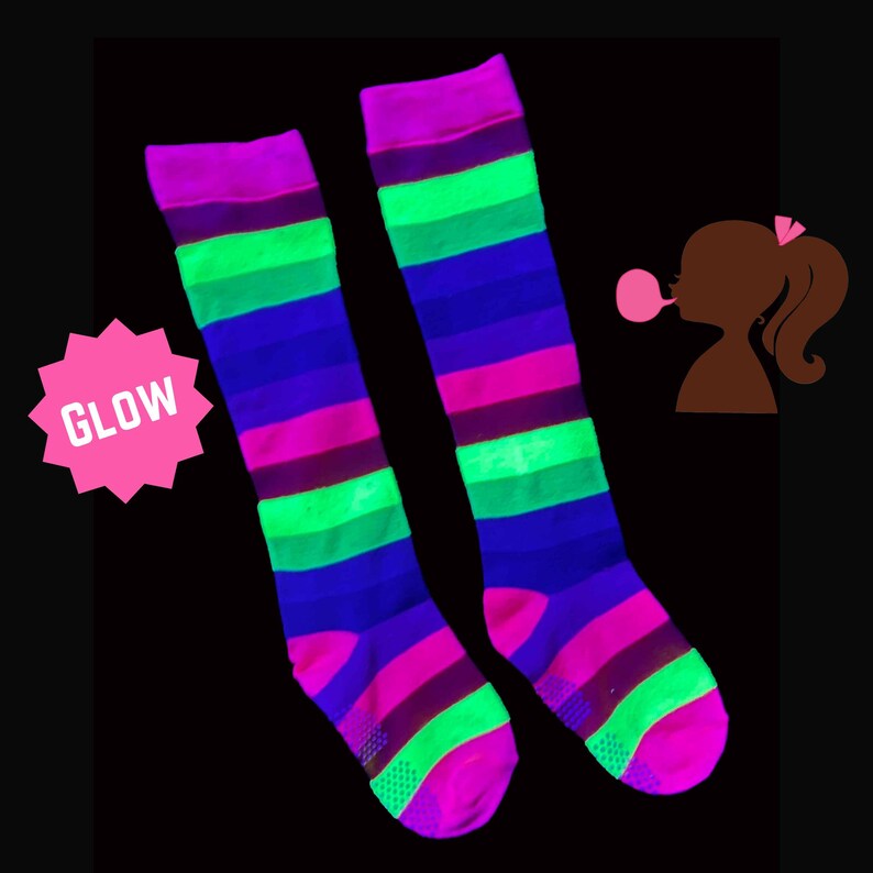 a pair of colorful striped socks sitting on top of a black background