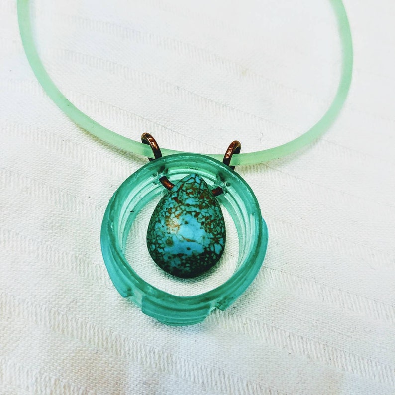 Seaside necklace simply elegant every day upcycled water bottle holding a dyed magnasite tear drop shaped stone turquoise color.