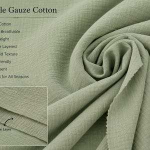 May include: Sage green double gauze cotton fabric with a crinkled texture. Text on the image includes: Double Gauze Cotton, 100% Cotton, Soft & Breathable, Lightweight, Double Layered, Crinkled Texture, Skin Friendly, Absorbent, Perfect for All Seasons.