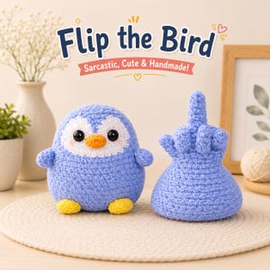 May include: Two handmade crochet items: a blue penguin with white accents and yellow feet, and a blue hand giving the middle finger. The text "Flip the Bird" and "Sarcastic, Cute & Handmade!" are displayed above the items.