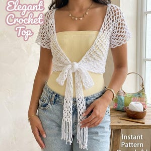 May include: A white crochet top with short sleeves and a tie closure. The top is paired with a yellow tube top and light blue jeans. The image includes the text "Elegant Crochet Top" and "Instant Pattern Download".
