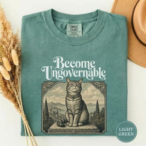 Become Ungovernable Vintage Cat Tee, Funny Gen Z Sarcastic Shirt, Woodcut Cat Lover Gift, Weird Feral Cat Mom Lover Humor Tshirt Light Green
