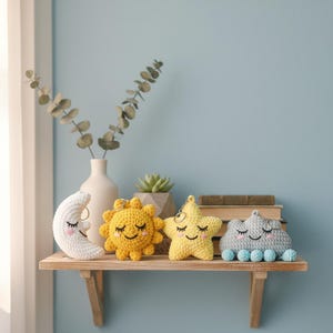 May include: A white ceramic mug with a black handle and the text "But First, Coffee" in a black, handwritten-style font. The mug is on a white surface.