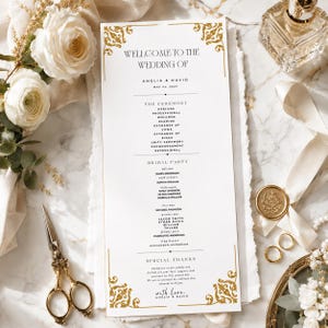 May include: A white wedding program card with gold ornate corner flourishes and black text. The header reads "WELLCOME TO THE WEDDING OF" followed by the names "AMELIA & DAVID", the date "MAY 24, 2029", ceremony details, bridal party list, and a thank you note.