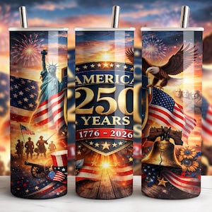 May include: A patriotic tumbler featuring the Statue of Liberty, American flags, an eagle, and the Liberty Bell. The design commemorates 250 years of America, with fireworks in the background. The tumbler has a silver straw.