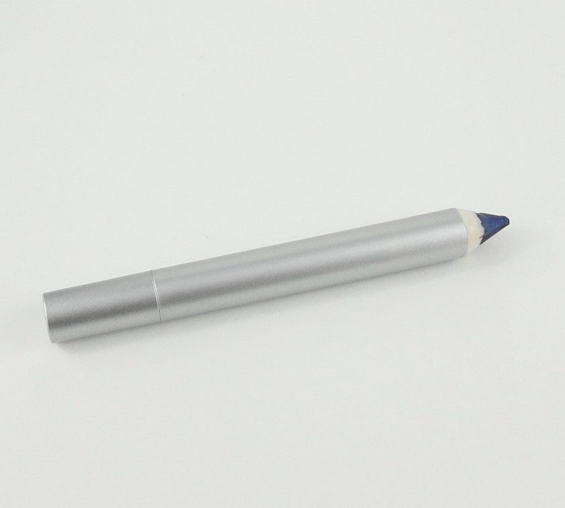 May include: A silver eyeliner pencil with a blue tip.