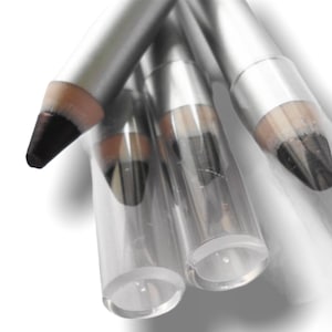 May include: Three silver eyeliner pencils with black tips. The pencils are in a clear plastic tube.