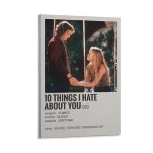 May include: A framed movie poster for "10 Things I Hate About You" from 1999. The poster features a romantic scene with two people holding hands. The title and credits are displayed in white text on a gray background.