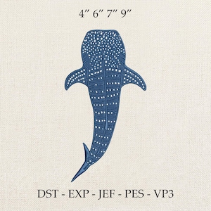 Puede incluir: Un diseño de tiburón ballena azul con detalles de puntos blancos, que mide 10, 15, 18 y 23 cm. El diseño se muestra sobre un fondo texturizado blanquecino. La imagen también incluye el texto "DST - EXP - JEF - PES - VP3".