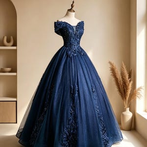 Back profile of a one size adjustable lace up corset tie back closure on a luxury navy blue starry tulle ball gown.