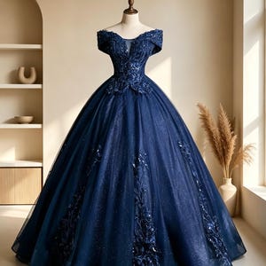 Close up of one size navy blue prom dress bodice featuring exquisite leaf embroidery and
shimmering navy sequins on mannequin.