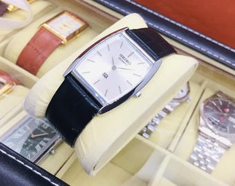 Vintage Seiko Barrel Tank Quartz: Silver Dial, Black Leather Belt, Wrist Watch