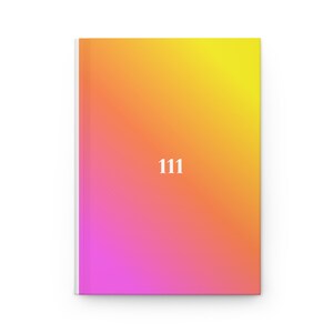 May include: A notebook with a gradient cover, shifting from yellow to orange to pink. The number "111" is printed in white on the cover. The notebook has a white spine.