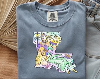 Camiseta con el mapa del Mardi Gras de Luisiana / Contorno colorido del estado, flor de lis