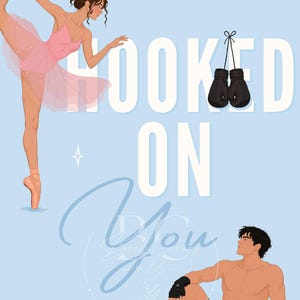 May include: A book cover illustration featuring a ballerina in a pink tutu and pointe shoes, a shirtless boxer in black shorts and hand wraps, and a pair of black boxing gloves. The text reads Hannah Michaels and Hooked On You.