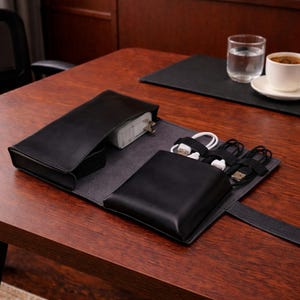 May include: A set of three ceramic mugs with a speckled, matte finish. The mugs are in shades of cream, light brown, and dark brown. Each mug has a simple, minimalist design and a rounded handle.