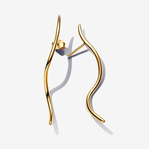 May include: A pair of gold-toned earrings featuring a long, slender, and gently curved wave-like design. Each earring has a smooth, polished metallic finish and includes a standard post-back closure mechanism for secure attachment to the earlobe.