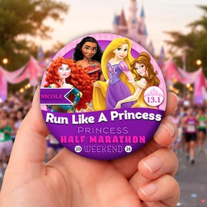 May include: A circular purple badge with the text "Run Like A Princess Half Marathon" and the numbers "20" and "26". The badge features illustrations of Disney princesses. The background shows a running event and a castle.