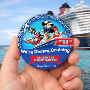 May include: A round blue button with the text "We're Disney Cruising" and "Aboard the Disney Fantasy". The button features Disney characters on a cruise ship, with the dates "April 16-20 2026". A Disney Cruise Line logo is at the bottom.