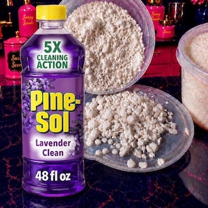 May include: A 48 fl oz bottle of purple Pine-Sol Lavender Clean liquid cleaner with a yellow cap. The label features the text 5X CLEANING ACTION, Pine-Sol, and Lavender Clean. Behind the bottle are two clear plastic containers filled with white granules.
