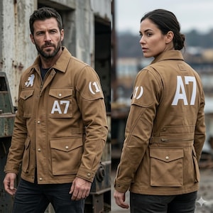 May include: A tan jacket with multiple pockets, a button-down collar, and white lettering. The jacket features the text "A7" on the back and front, and a white patch with a number on the sleeve. The jacket is worn by a person.