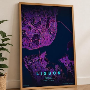 May include: A framed map print of Lisbon, Portugal, with a modern, neon-style design. The map features a dark blue background with vibrant pink and purple city details. The word "LISBON" is displayed in teal, with the country and coordinates below.