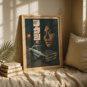May include: A framed vertical poster featuring a dark, moody illustration of a vintage silver coupe car parked on a road at night. Above the car, a large portrait of a person's face is visible, accompanied by vertical Japanese text in white.