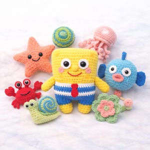 May include: A set of three ceramic mugs with a speckled, matte finish in cream, light grey, and dark grey. Each mug has a simple, minimalist design, ideal for coffee or tea.