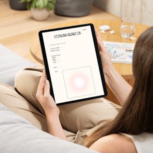 May include: A black tablet displaying a fitness results form with the title "Fitness Results". The form includes fields for weight, measurements, and other data. The tablet is held by a person.
