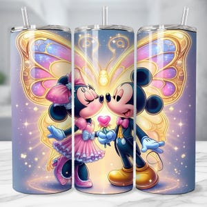 May include: A stainless steel tumbler featuring Mickey and Minnie Mouse kissing, set against a backdrop of a butterfly with pink, purple, and gold wings. The design includes a heart-shaped flower and sparkling accents.