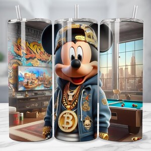 May include: A stainless steel tumbler featuring Mickey Mouse in a blue jacket, gold chains, and a Bitcoin pendant. The background shows a room with graffiti art, a cityscape, and a pool table. The tumbler has a clear straw.