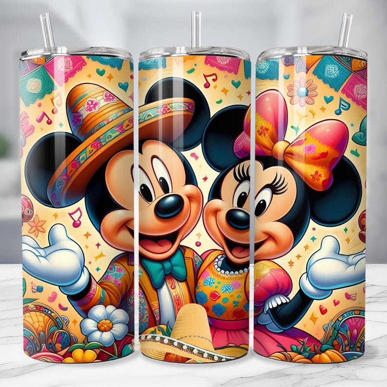 May include: A set of three stainless steel tumblers featuring Mickey and Minnie Mouse in festive Mexican attire. The design includes sombreros, colorful patterns, and musical notes against a yellow background. Each tumbler has a clear straw.