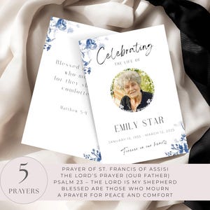 May include: Two white memorial cards with blue floral accents. One card reads "Celebrating the Life of Emily Star" with a photo and dates. The other card has text from Matthew 5:4. A circle shows "5 Prayers" and a list of prayers.