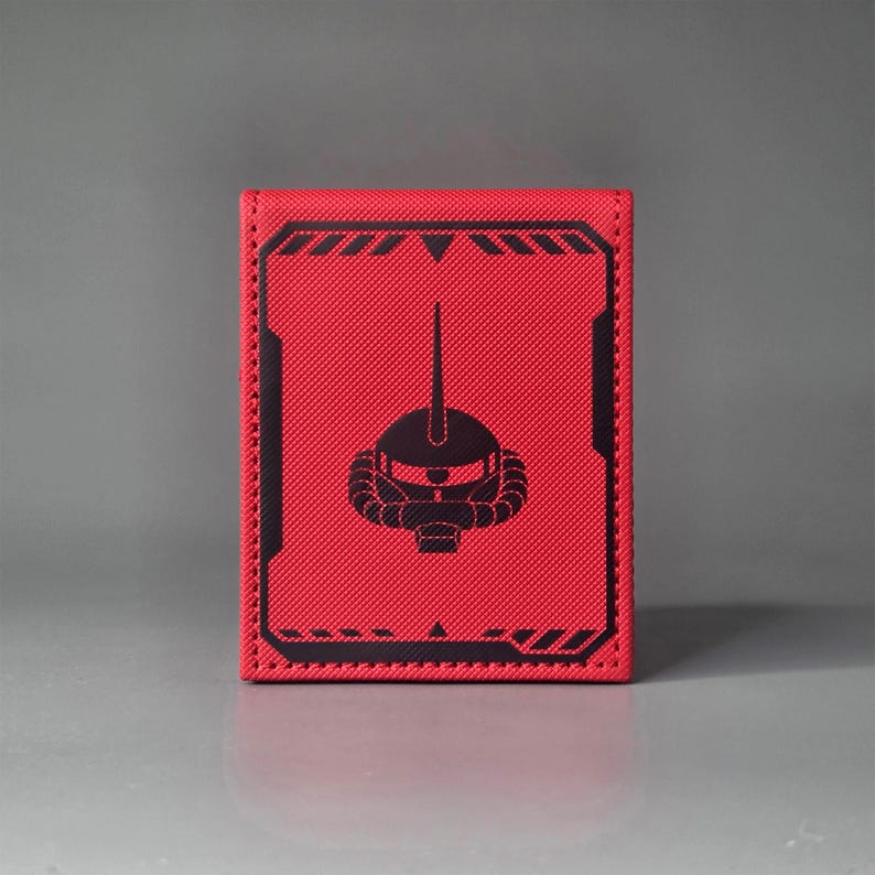 Back view of red anime mecha themed deck box with Gundam style helmet emblem and panel line detailing
