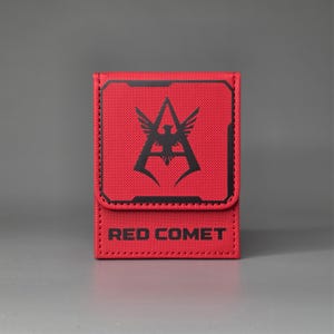 Front view of red Gundam inspired deck box with large faction emblem and Red Comet marking on lower panel