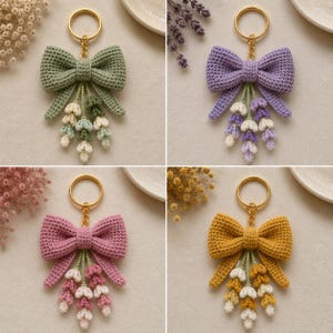 May include: Four crochet keychains featuring a large bow attached to a gold-tone metal ring. Each bow is paired with three dangling floral sprigs in matching color palettes of sage green, lavender, dusty rose, and mustard yellow with cream accents.