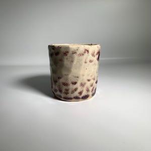 May include: A rustic wooden sign with the words "Welcome to our home" in white lettering. The sign has a distressed finish and a simple, inviting design, suitable for a front porch or entryway.